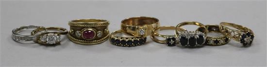 Nine assorted 9ct gold and gem set dress rings.